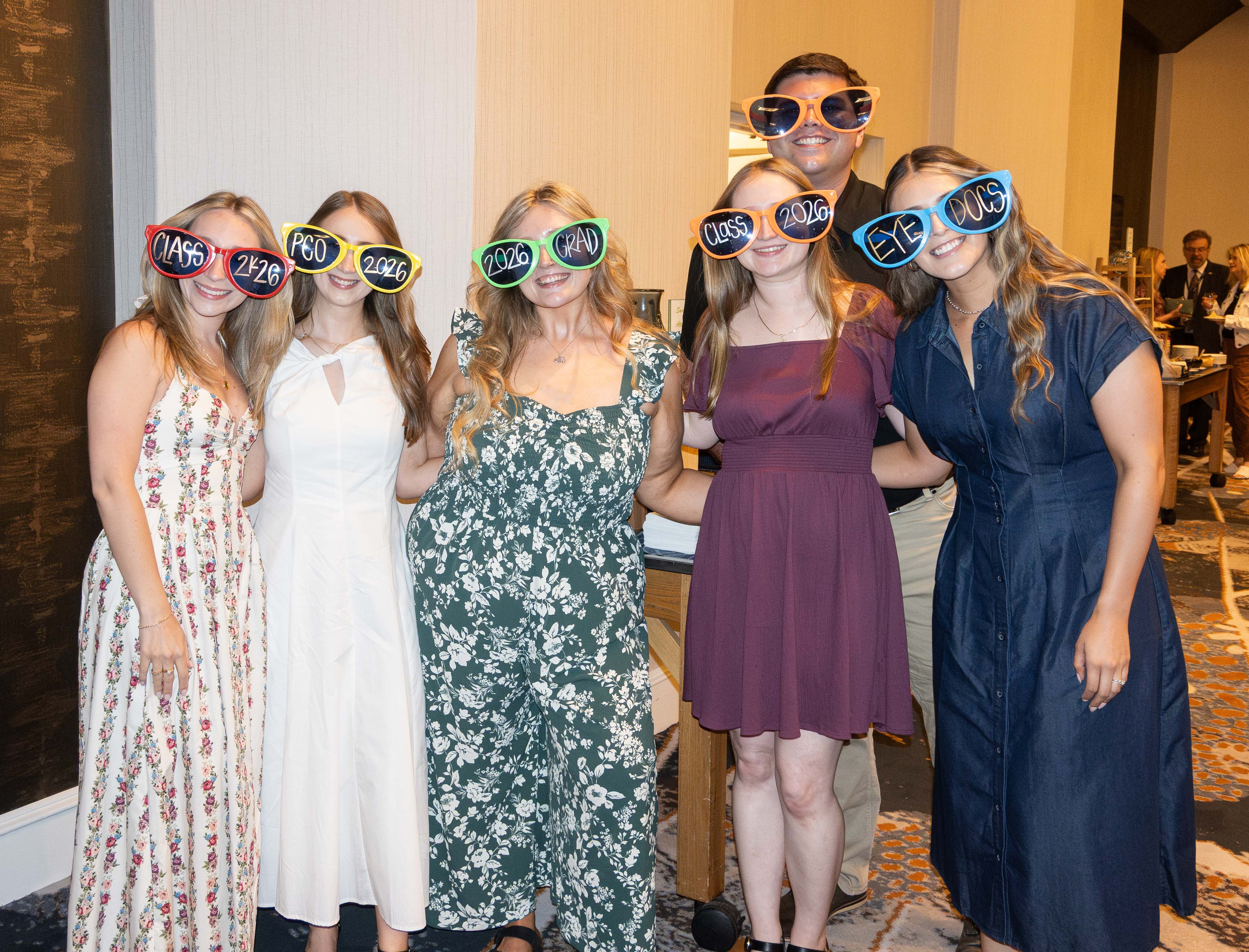 PCO grads in funny glasses at graduation awards reception