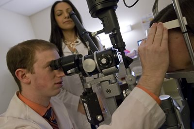 Optometrist working with a patient