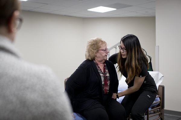 OT student helping patient