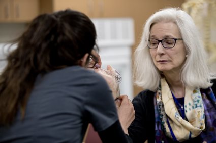 OT student helping patient