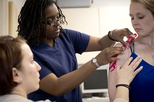 OT students working with a patient