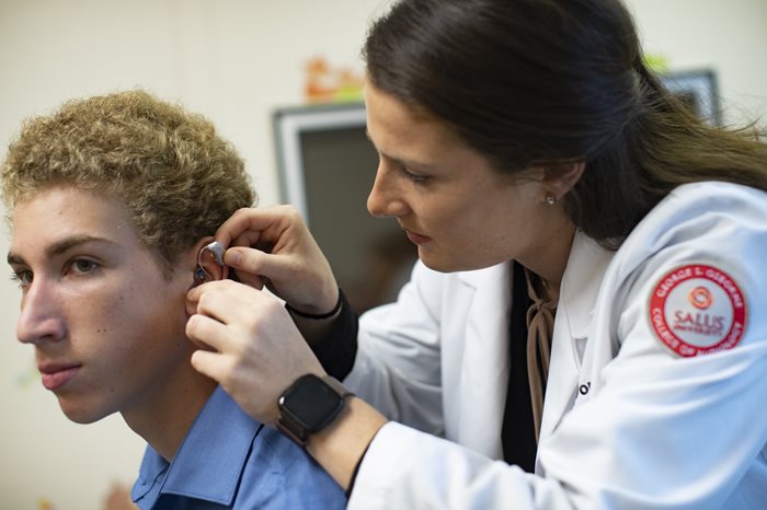 patient being fitted for hearing aid