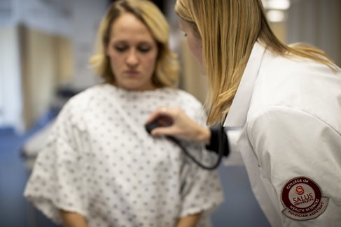 PA student examining a patient