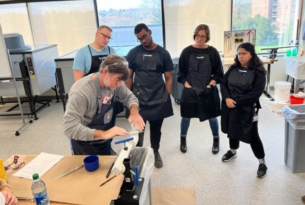 Dr. Duncan teaching students in the O&P lab