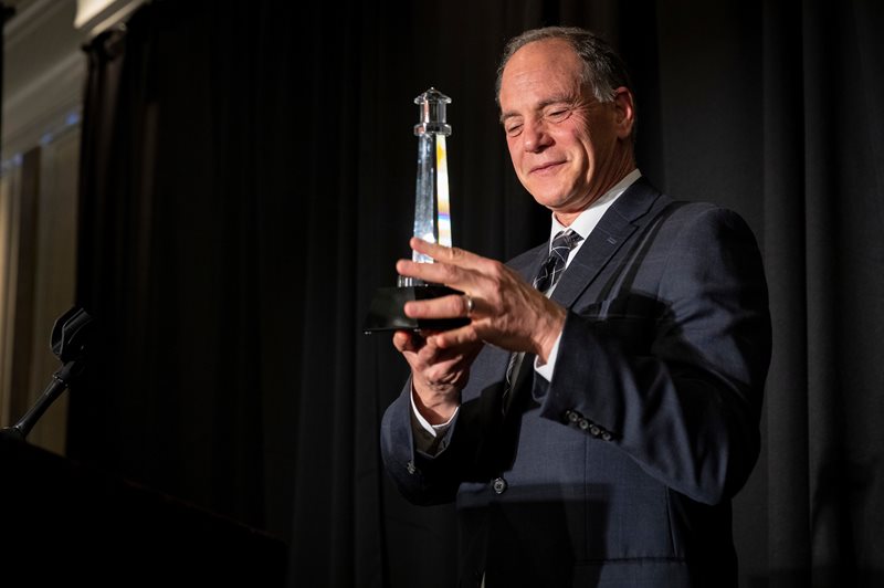 Alan Lindy holding the Lighthouse Award