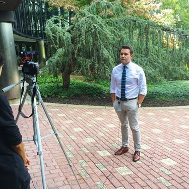 Dr. Meagher filming a video outside