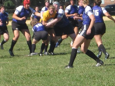 Anna Grasso getting tackled in rugby