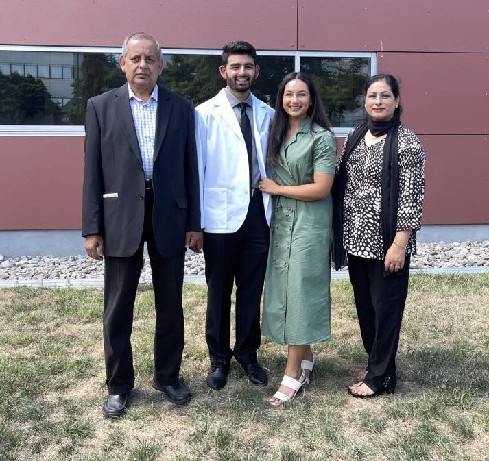 Asef and family at white coat