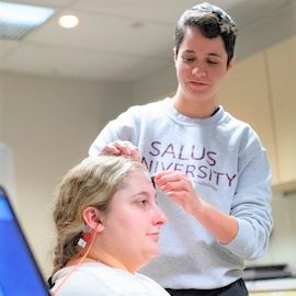 Audiology student with patient