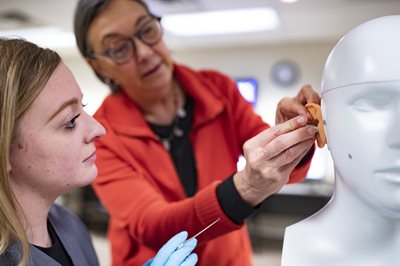 Dr. Owen working with a student