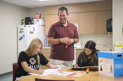 Speech-Language Pathology students with faculty member