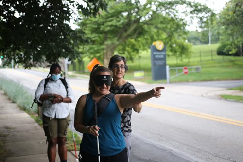 BLVS students using blindfolds and canes