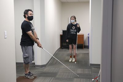 BLVS students practicing walking with a white cane