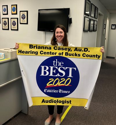 brianna casey holding poster