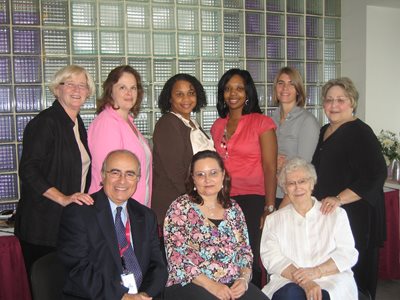 CER “Grant Team” of faculty and staff celebrate a 2009 grant award.  Shown (L to R) are: front row, Dr. Tony Di Stefano; Ms. Tina Fitzpatrick; Mrs. Mary Huebner. Back row: Dr. Audrey Smith; Ms. Wendy Woodward; Ms. Lachelle Smith; Ms. Tracey Robbins; Dr. Brooke Kruemmling; Dr. Kathleen Huebner.