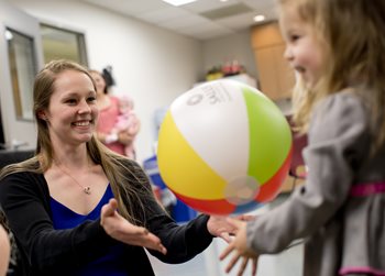 pediatric OT patient with a beach ball