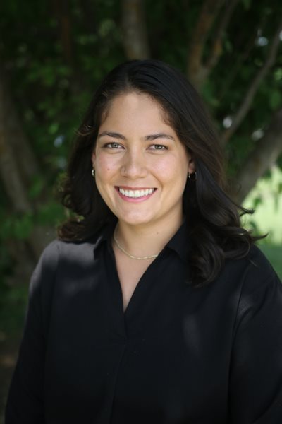 Denise Diaz headshot outside wearing a black shirt