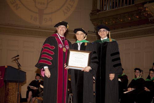 Dr. Scheiman being presented an honorary degree