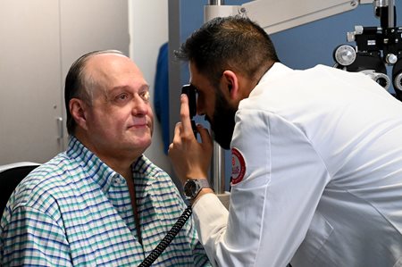 Pratik Shah providing an eye exam