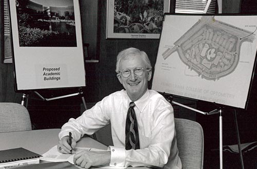 Dr. Thomas Lewis sitting at a desk