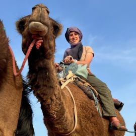 Gabrielle Verrillo riding a camel