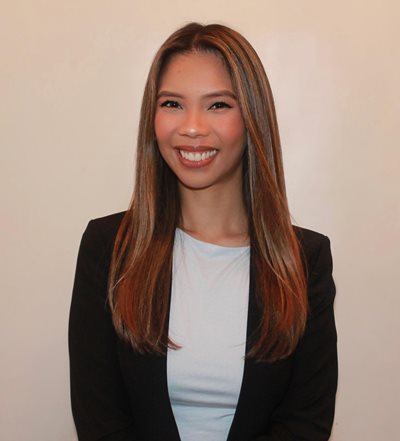 Gayle Caldomo headshot smiling wearing a black blazer and light blue shirt