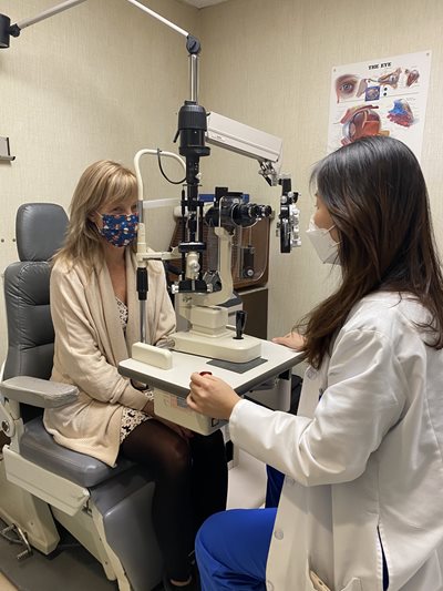 Dr. In-Ae “Grace” Choi working with a patient at TEI