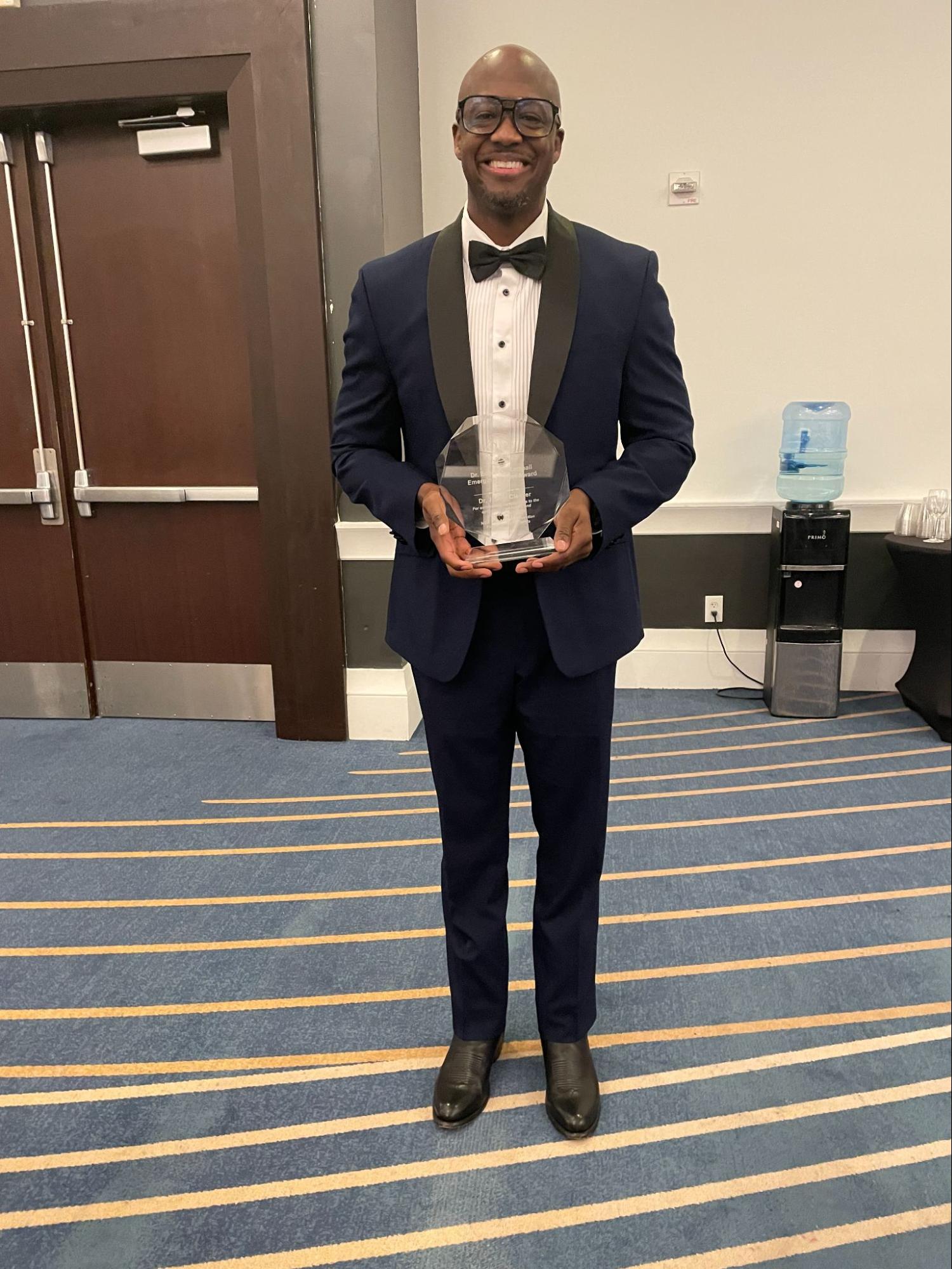 Jacobi Cleaver holding his award