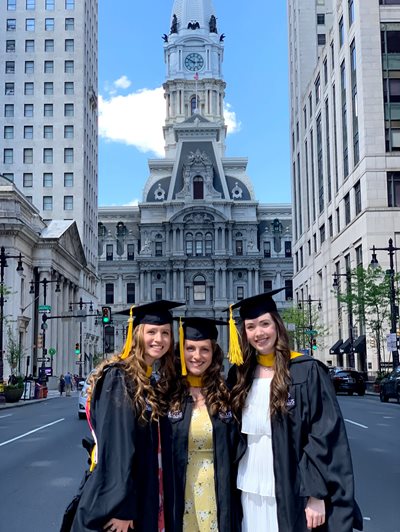 Megan and her friends on broad street after Salus graduation