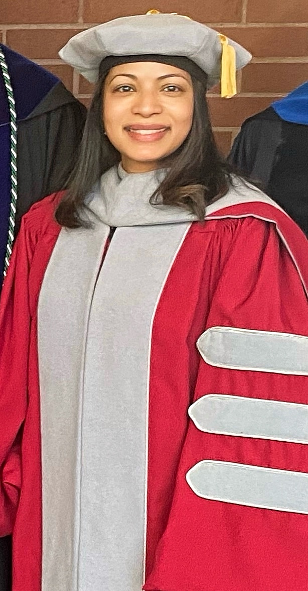 Jenny Ragan in commencement regalia headshot