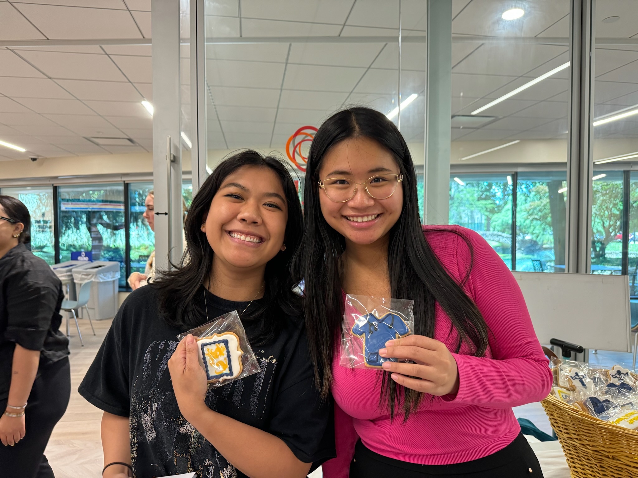 students holding cookies