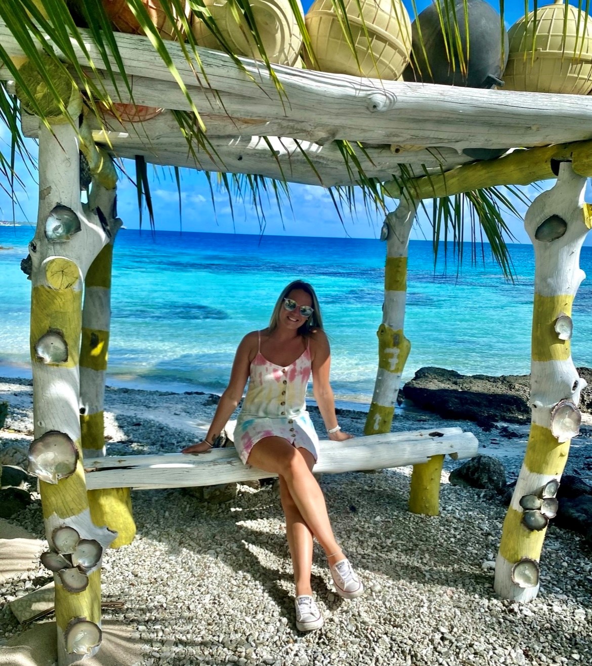 Kristy Lee Bilger sitting among the palms