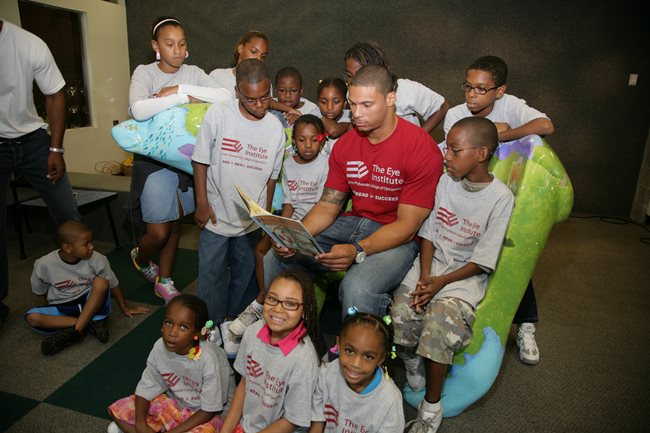 L.J. Smith reading to pediatric TEI patients