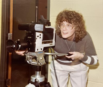 woman holding video camera