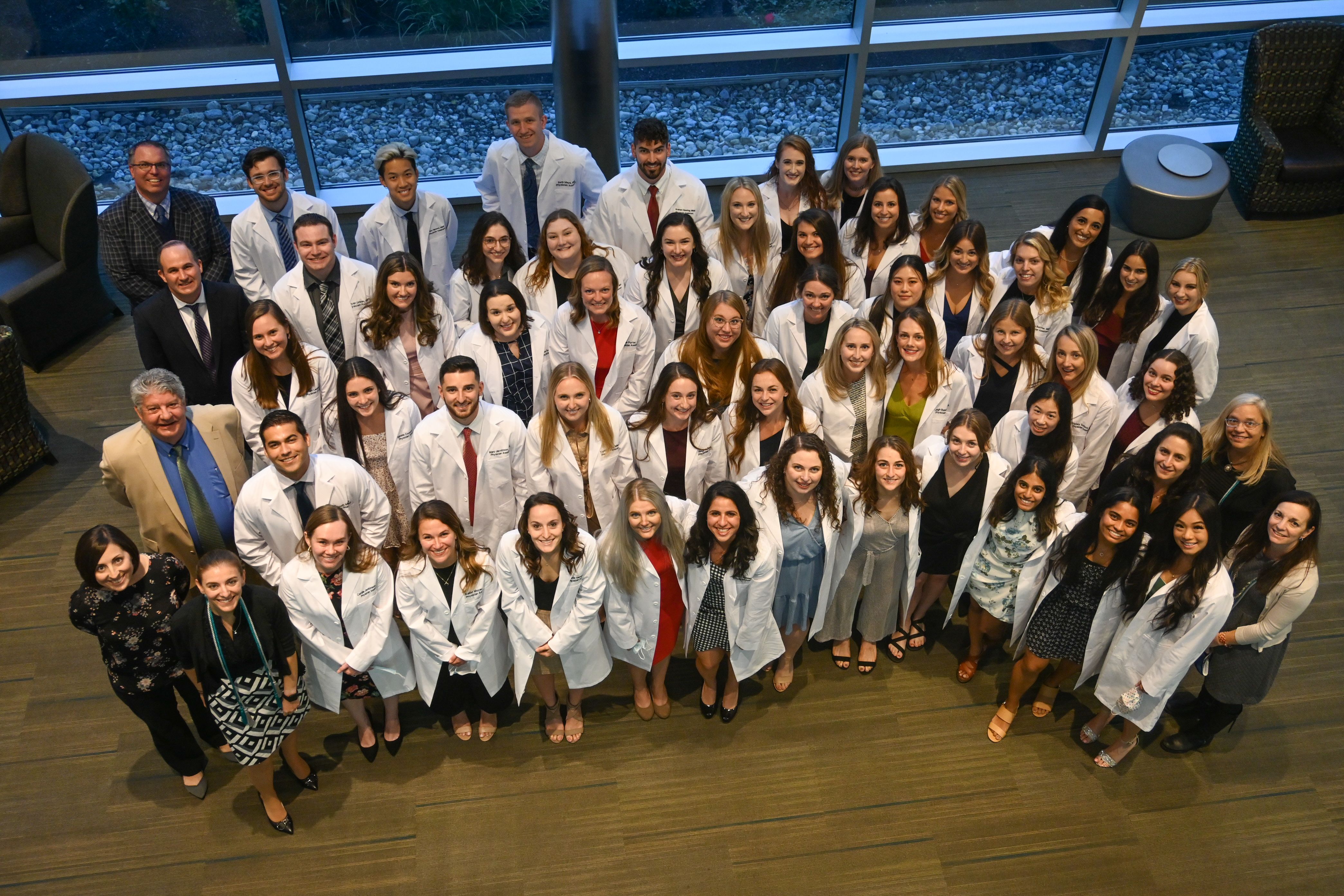 Long White Coat luncheon attendees group photo