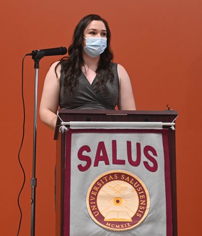 Kaitlyn Carmo speaking at the long white coat ceremony