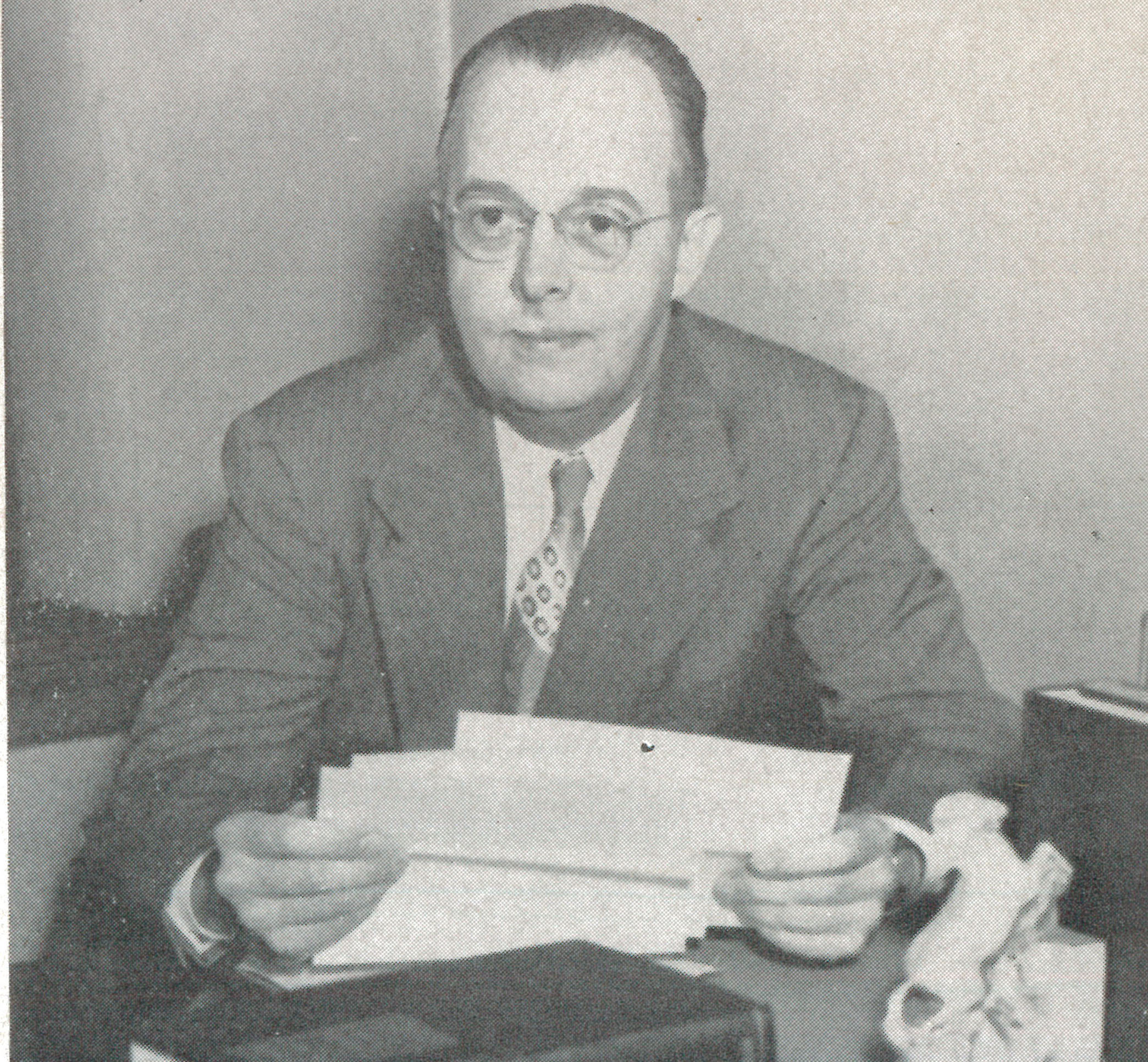 George MacElree, Jr. sitting at a desk