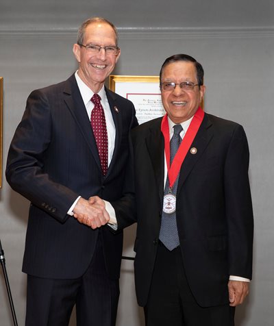 Dr. Mittelman and Dr. Verma shaking hands