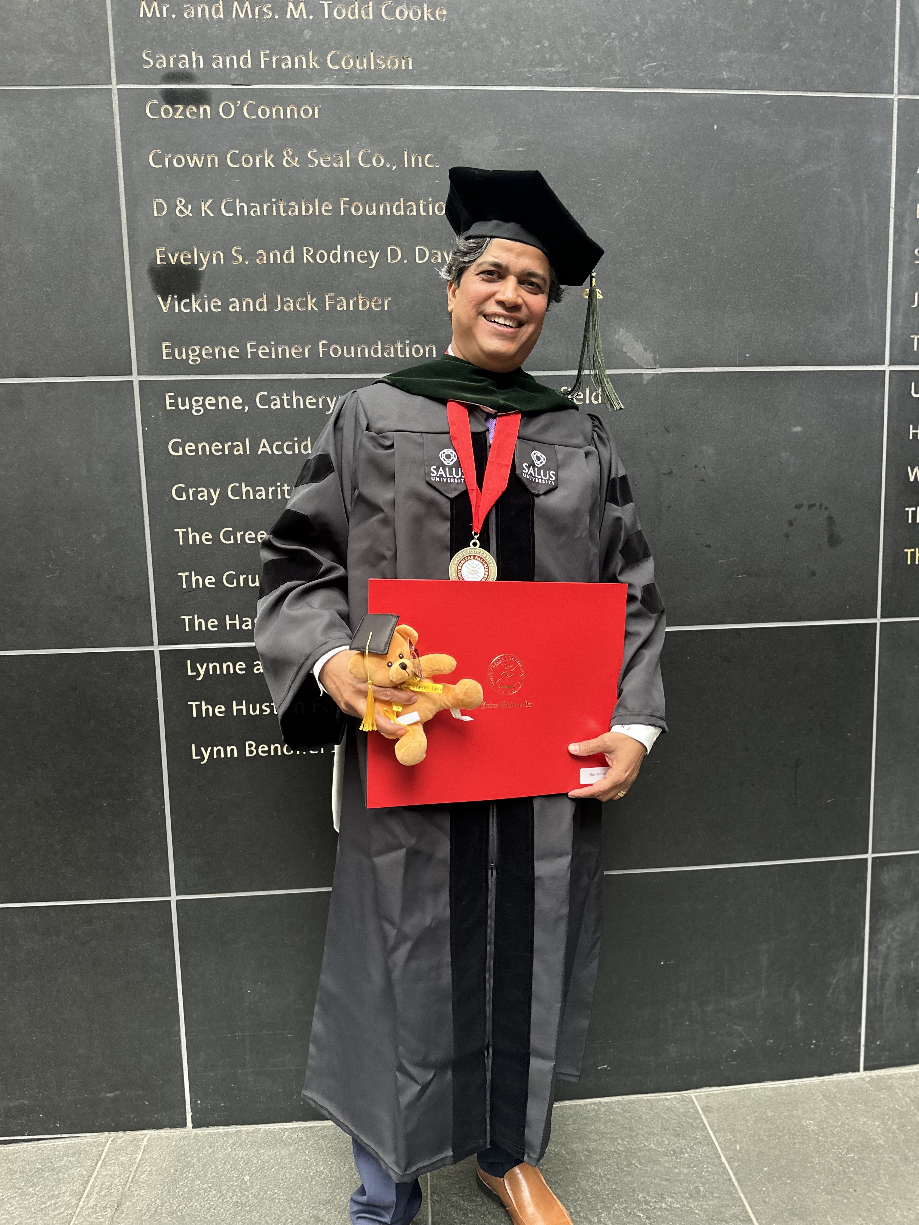 Mrinal Jha at graduation with diploma