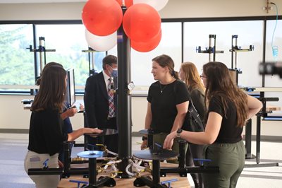 People at ribbon-cutting party