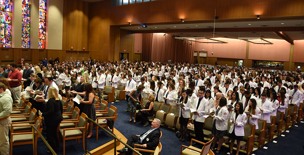 students in white coats