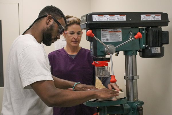 O&P student working with professor in lab