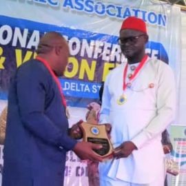 Dr. Osigwe receiving award