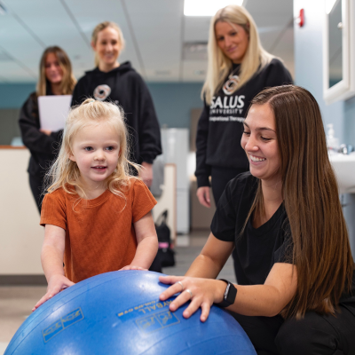 Occupational therapists working with a pediatric female client