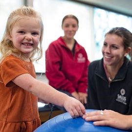 OT Students with young girl