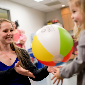 pediatric OT patient playing with ball