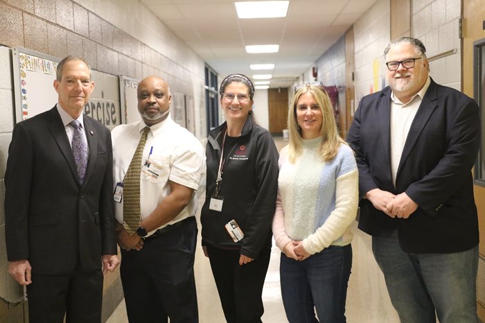 Dr. Scombordi-Raghu with her team and President Mittelman