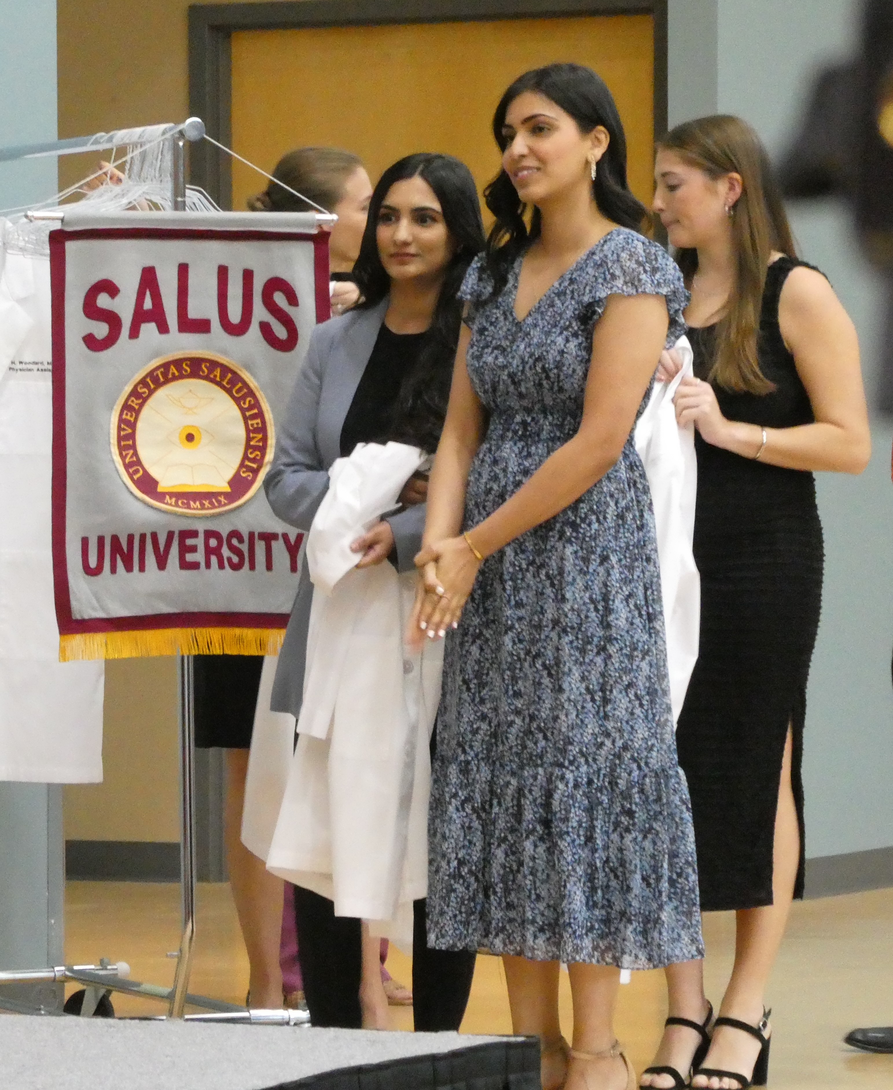 Nimra Tahir and sister Sana Tahir with white coat