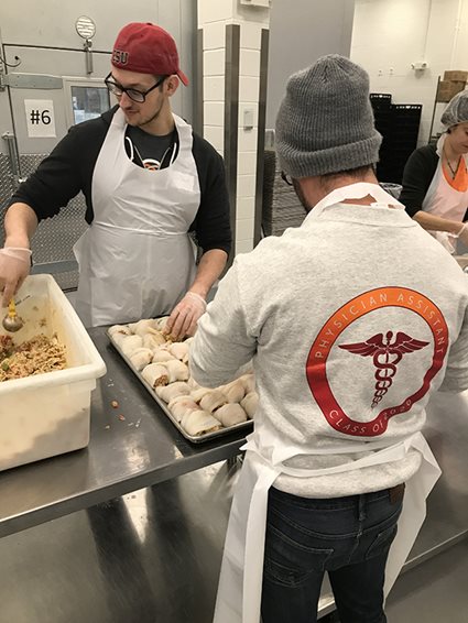 PA students volunteering at MANNA