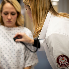 PA student examining a patient